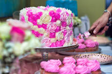 Picture of beautiful Sweet sixteen pink and white cake being cut before being served at a birthday party in Hialeah